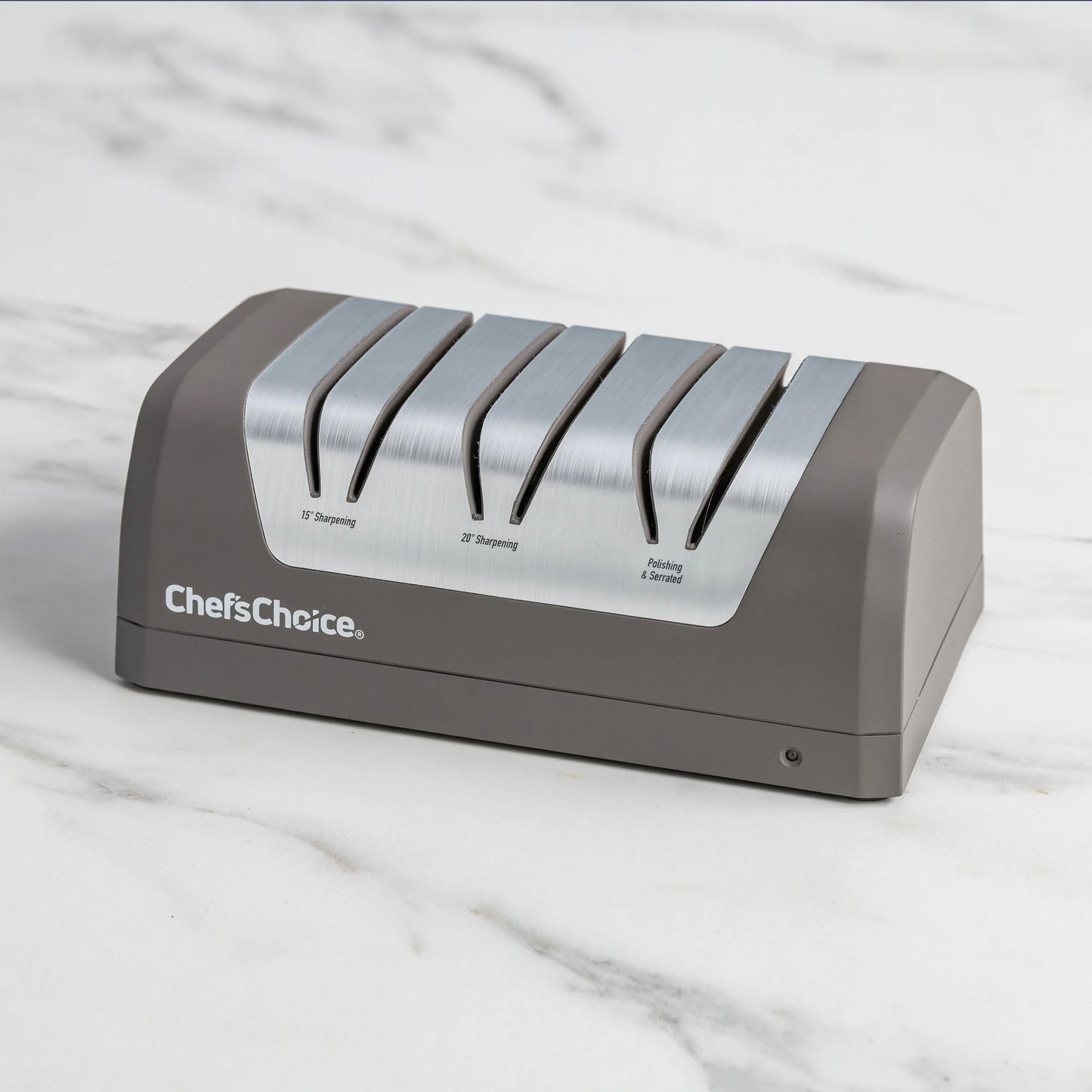 Gray Chef'sChoice electric sharpener with five metal sharpening slots on countertop
