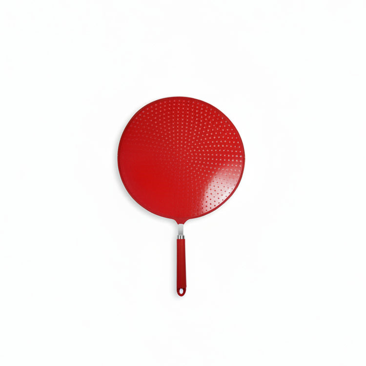 Red perforated pancake turner on a white background