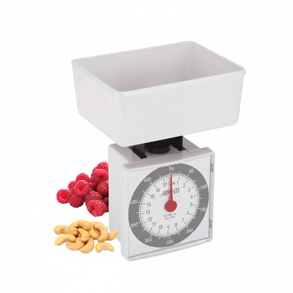 Compact mechanical kitchen scale with white weighing tray and round analog dial