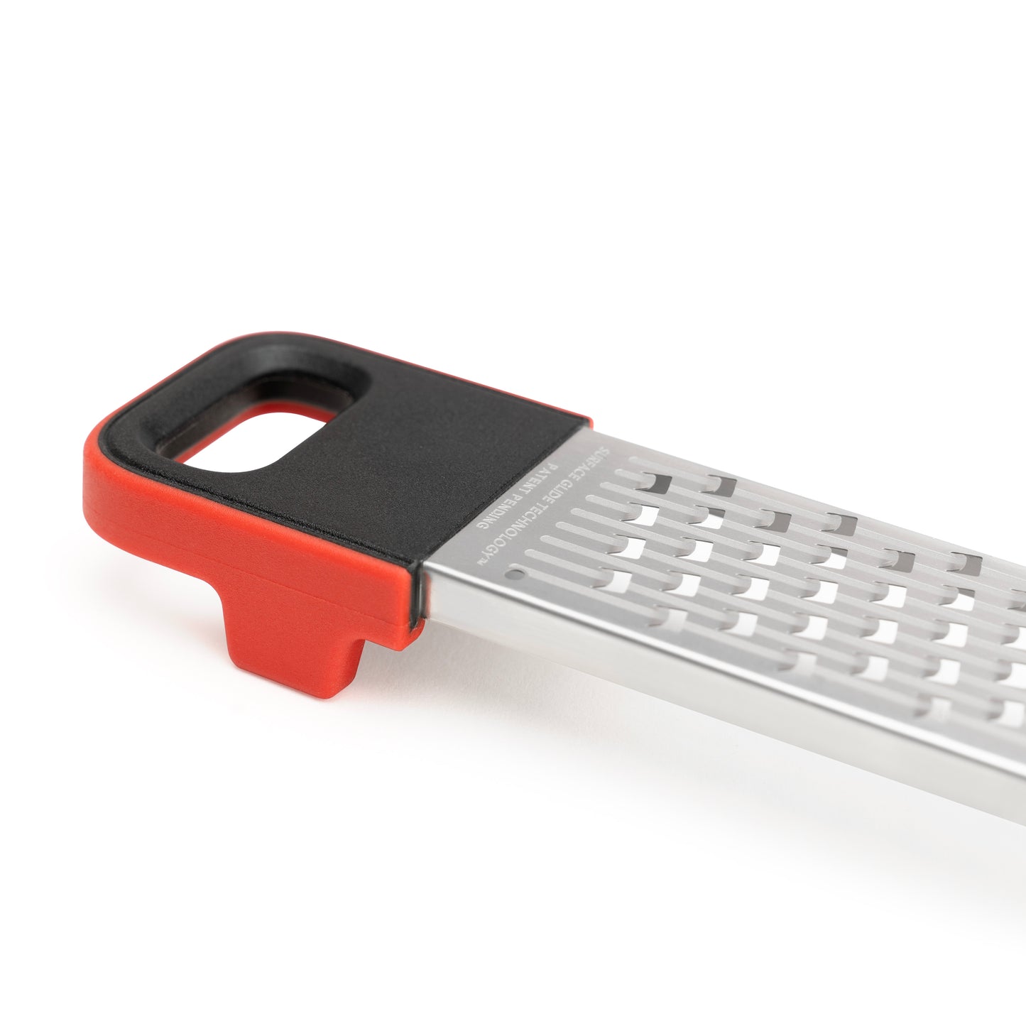 Stainless grater with red/black handle and perforated grating surface