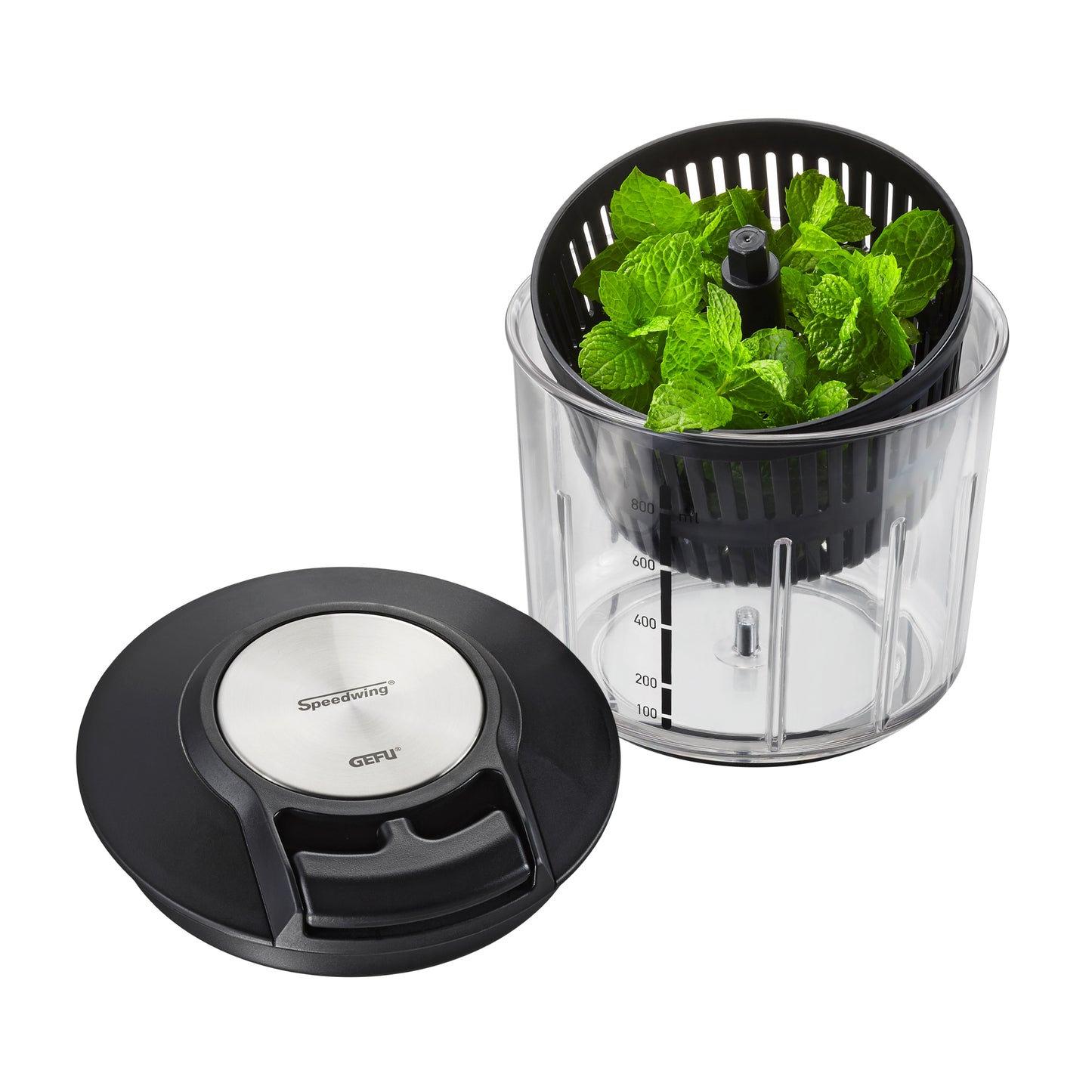 Multi-chopper bowl filled with green mint leaves and black top