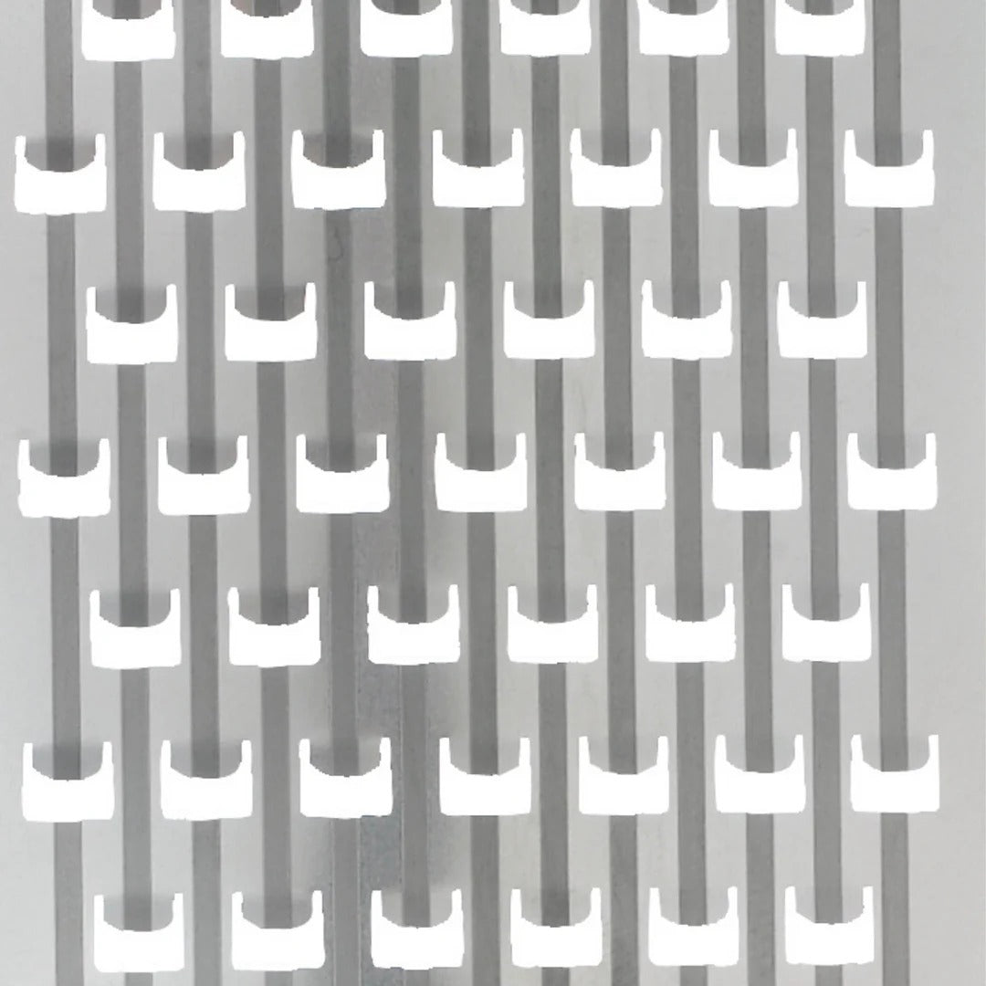 Rotary grater blade teeth on metal drum surface