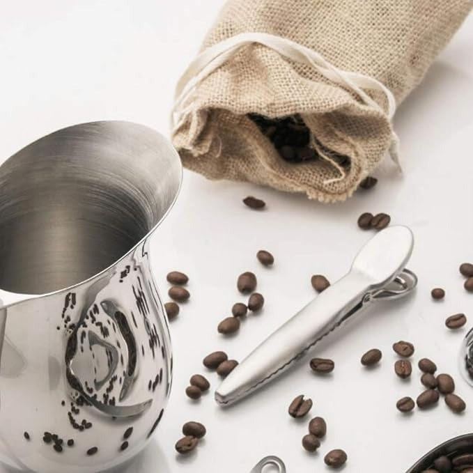 Silver stainless bag clip with ridged handle and clamp on coffee bean bag