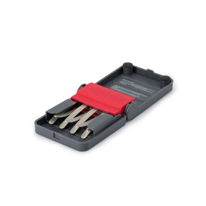Diamond claw knife sharpener in gray case with red insert and metal sharpening blades