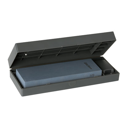 Opened dark gray case with 320-grit silicone carbide sharpening stone and side compartment