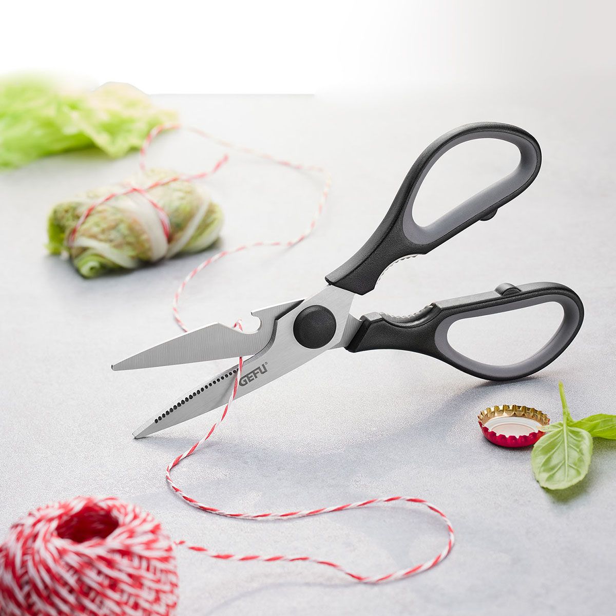 General-purpose scissors with dark loop handles and steel blades