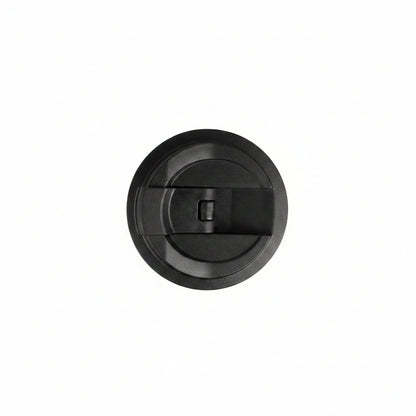 Black plastic cover with a central cylindrical component on a white background