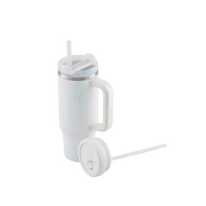 White textured insulated tumbler with two lids and drinking straw.