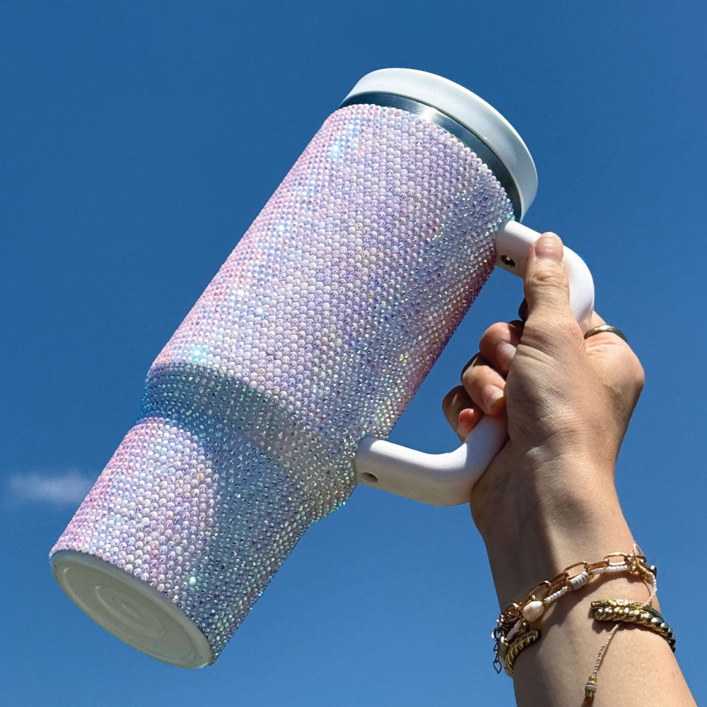 Iridescent insulated tumbler with two lids, carry handle and straw, side view