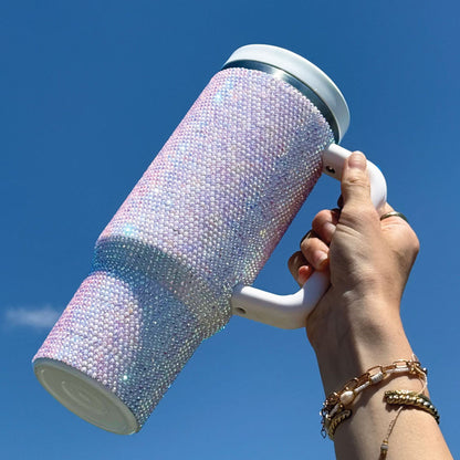 Iridescent insulated tumbler with two lids, carry handle and straw, side view