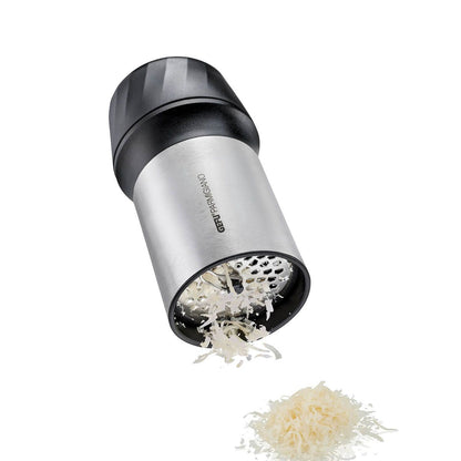Handheld cheese grater dispensing white cheese shavings; stainless-steel barrel