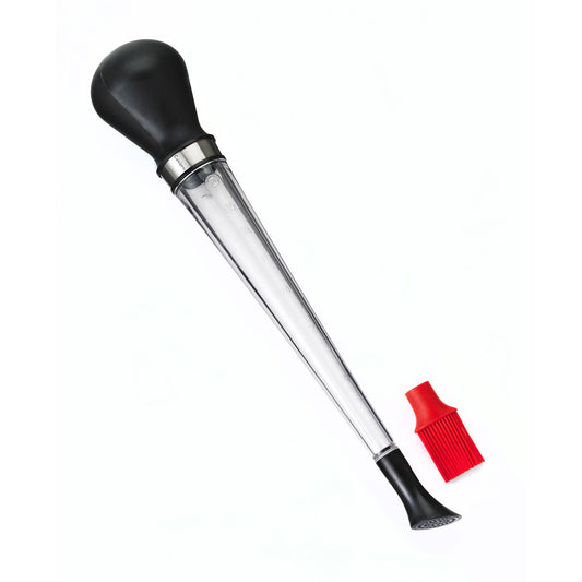 Clear tube turkey baster with black bulb handle and red tip attachment