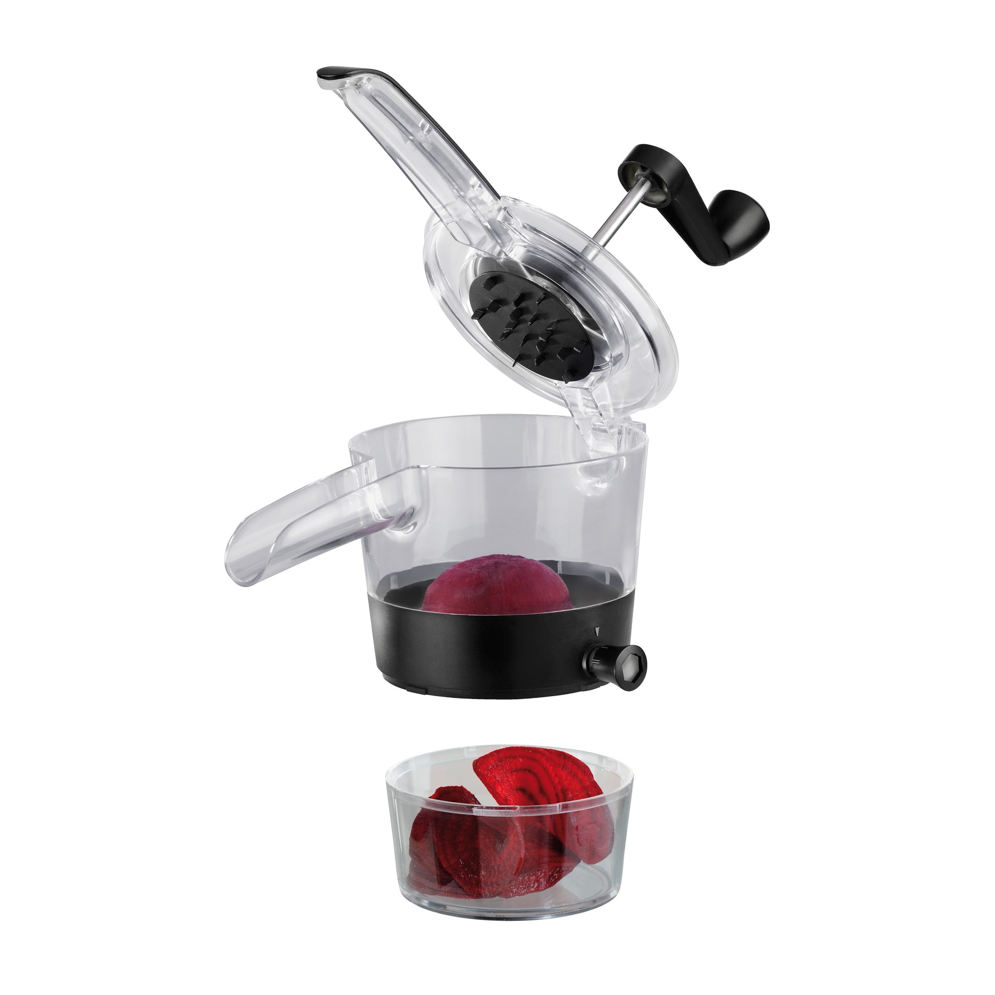 Spiral slicer top cutting head and clear bowl with red vegetable slices
