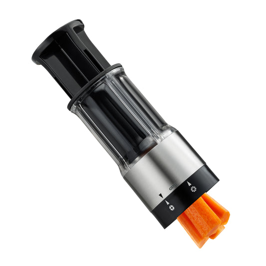 FLEXICUT vegetable and fruit splitter with stainless body, clear chamber, shown splitting carrot