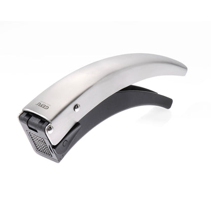 Silver-and-black garlic cutter with curved lever and grated cutting surface