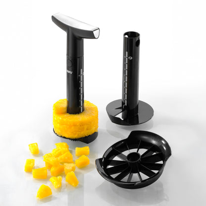 Pineapple slicer set with black handles, stand, and sliced pineapple
