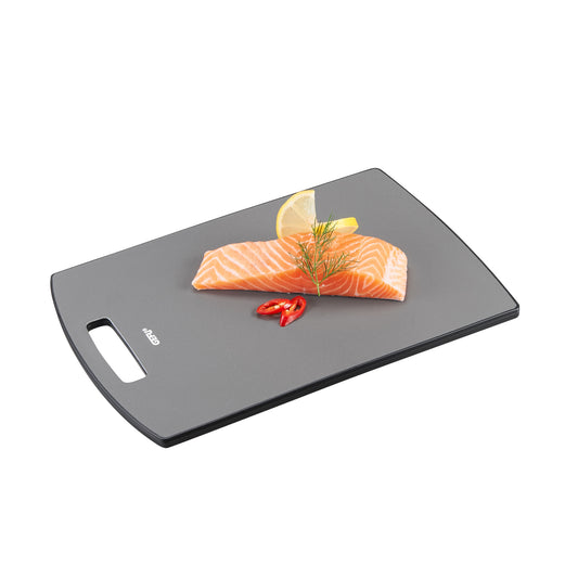 Dark gray cutting board with side hand grip, salmon fillet and chili on top