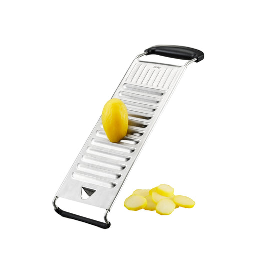Stainless steel potato slicer with black handles, showing sliced yellow potato pieces