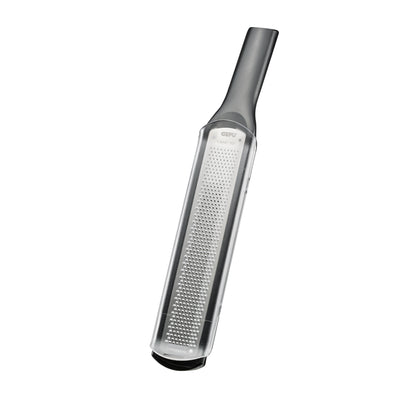 Fine grater with perforated metal surface and dark handle