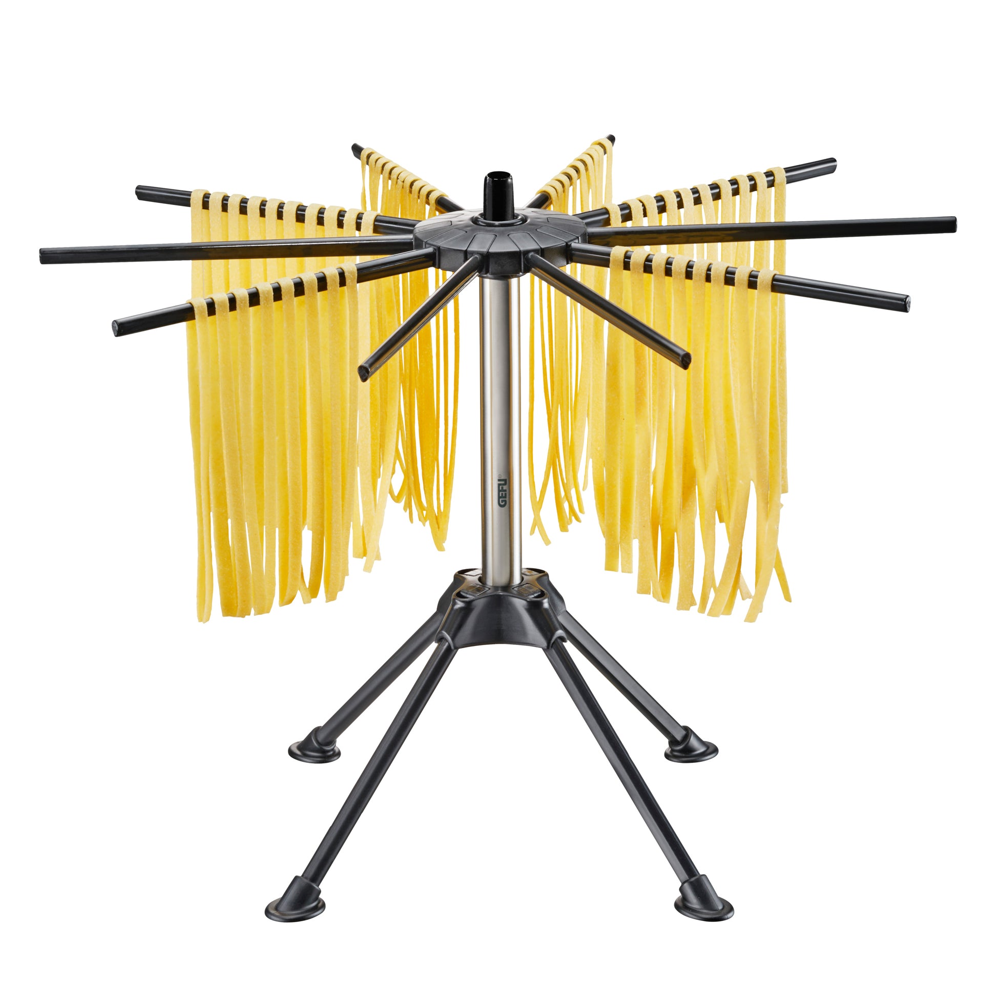 Black metal pasta drying rack with eight arms and yellow hanging pasta strands