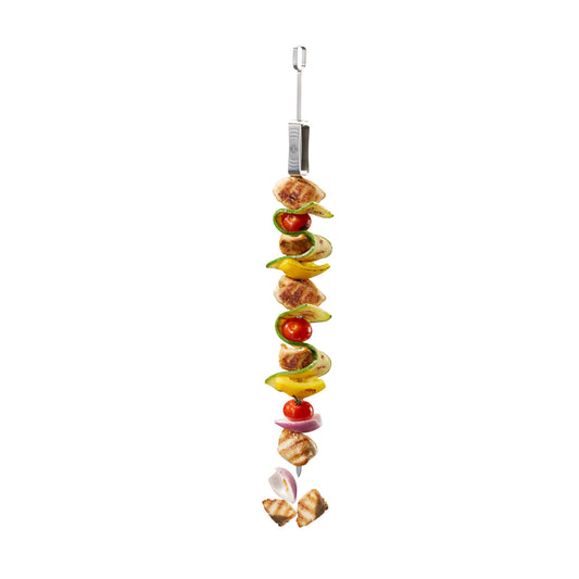 BBQ skewer with grilled meat, peppers, and onion on metal prongs