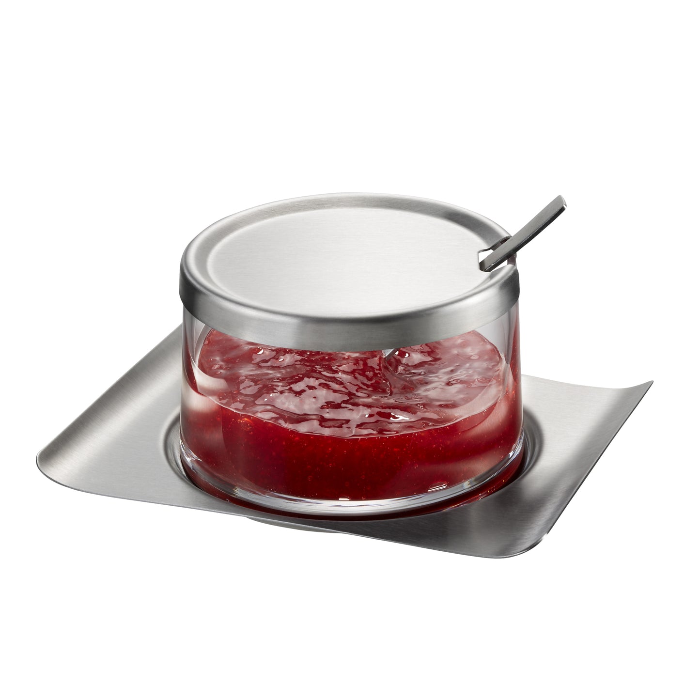 Glass jam jar with metal lid and spoon, filled with red jam on tray