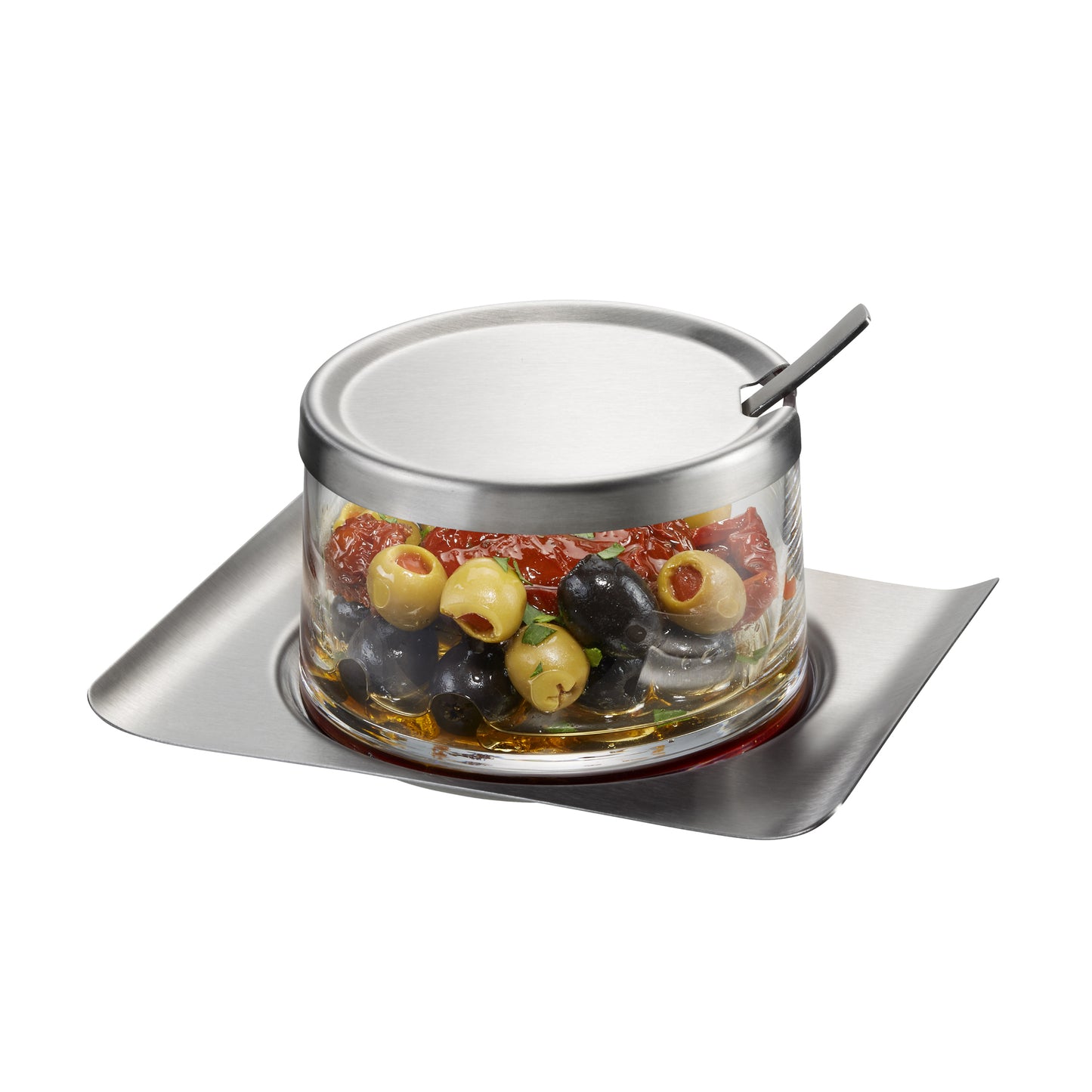 Glass jam jar with metal lid and spoon, filled with olives on tray