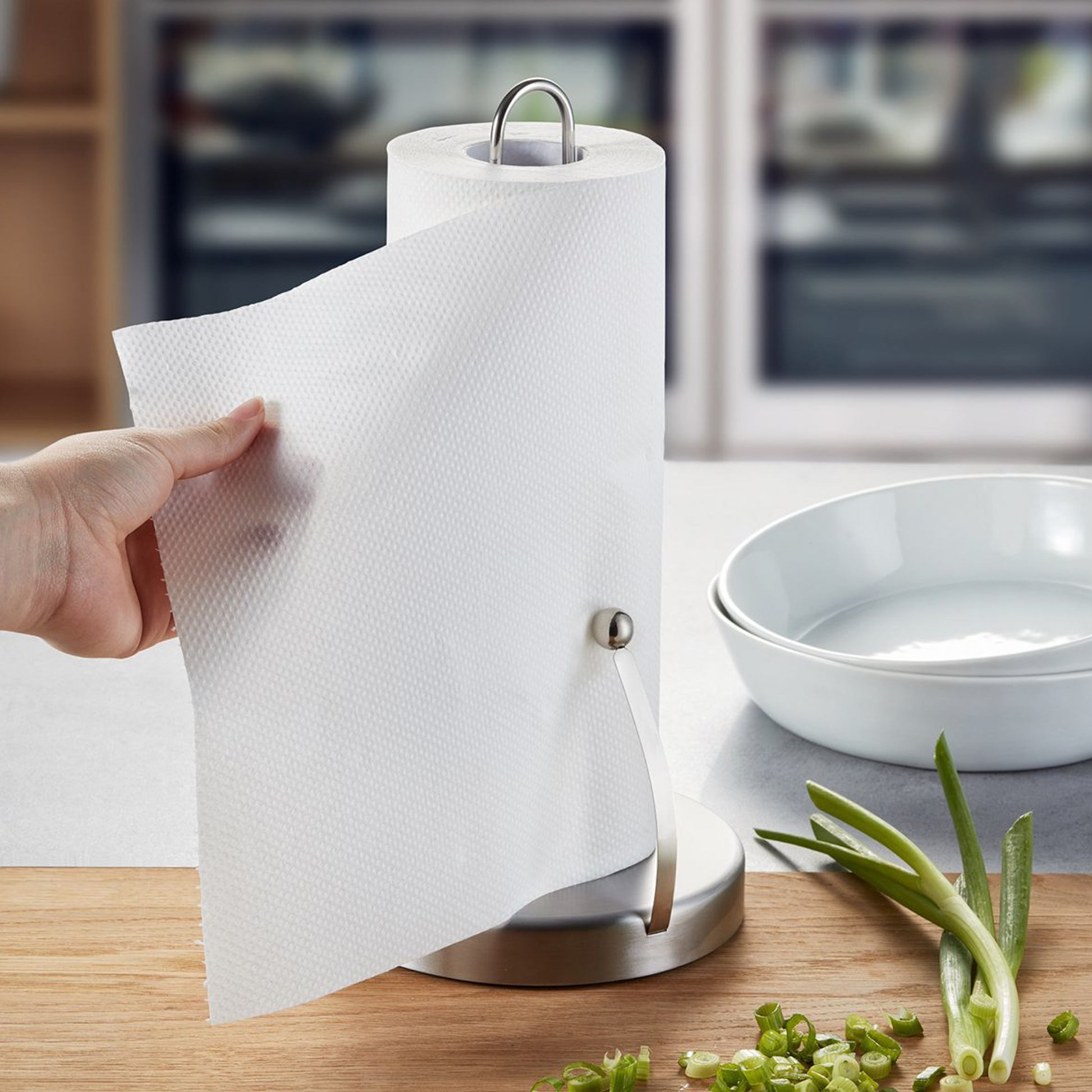 SPENSO kitchen roll holder on counter with white paper roll being pulled
