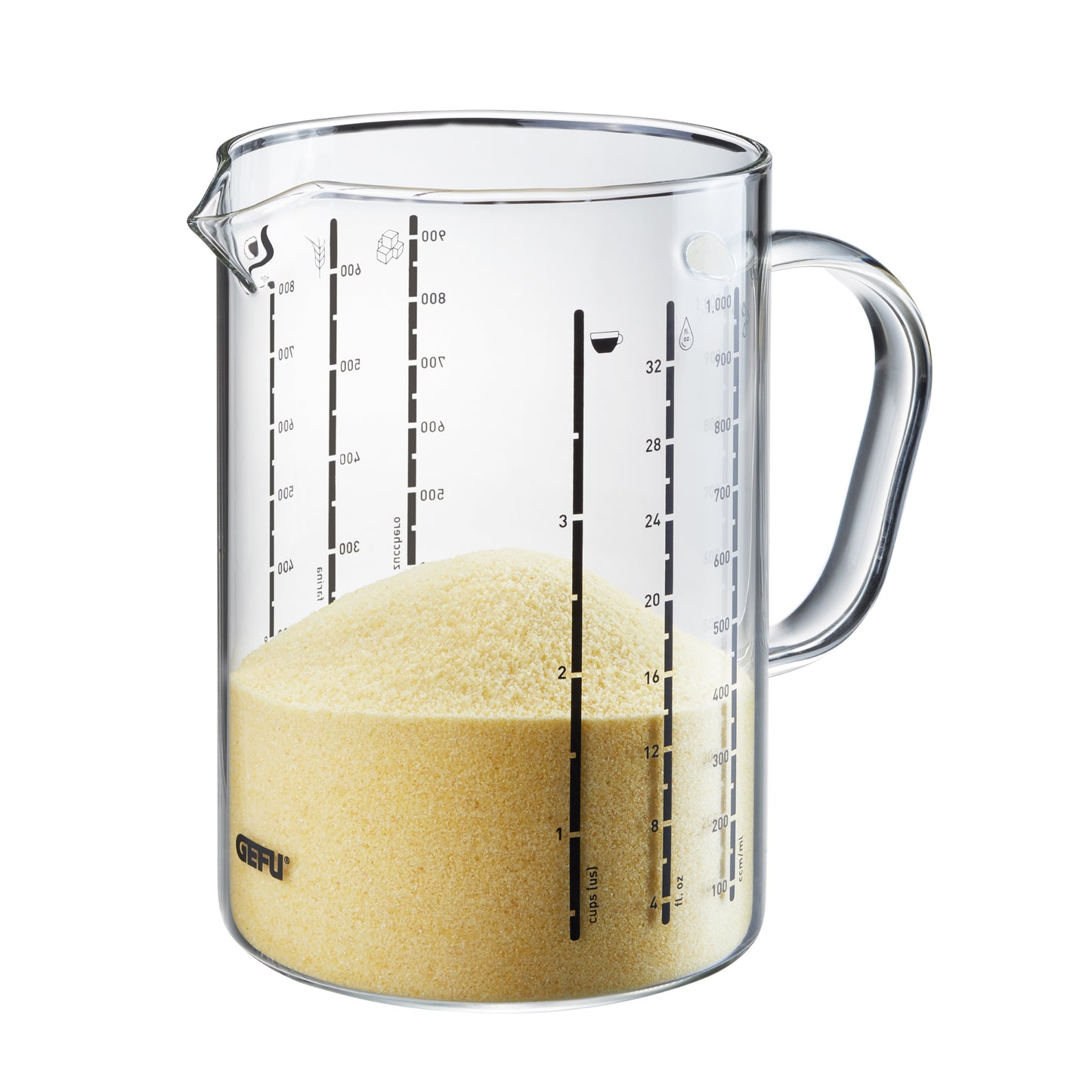 Clear measuring jug with spout, handle, and markings; filled with pale yellow granules