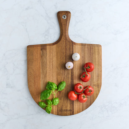 Acacia wood pizza paddle board with handle and hanging hole, tomatoes and herbs