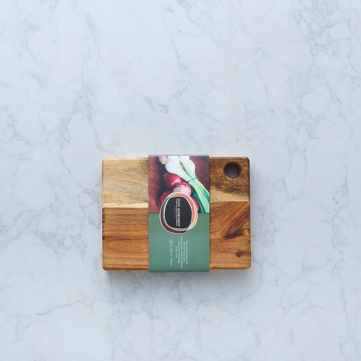 Wooden utility cutting board with hanging hole and an attached product card