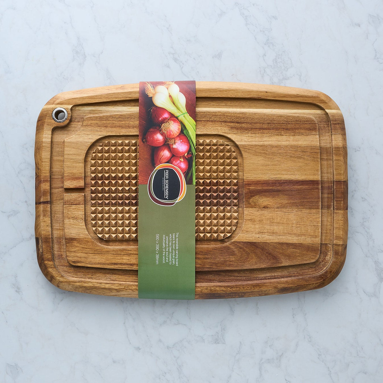 Wood reversible carving board with textured insert and hand grip cutout