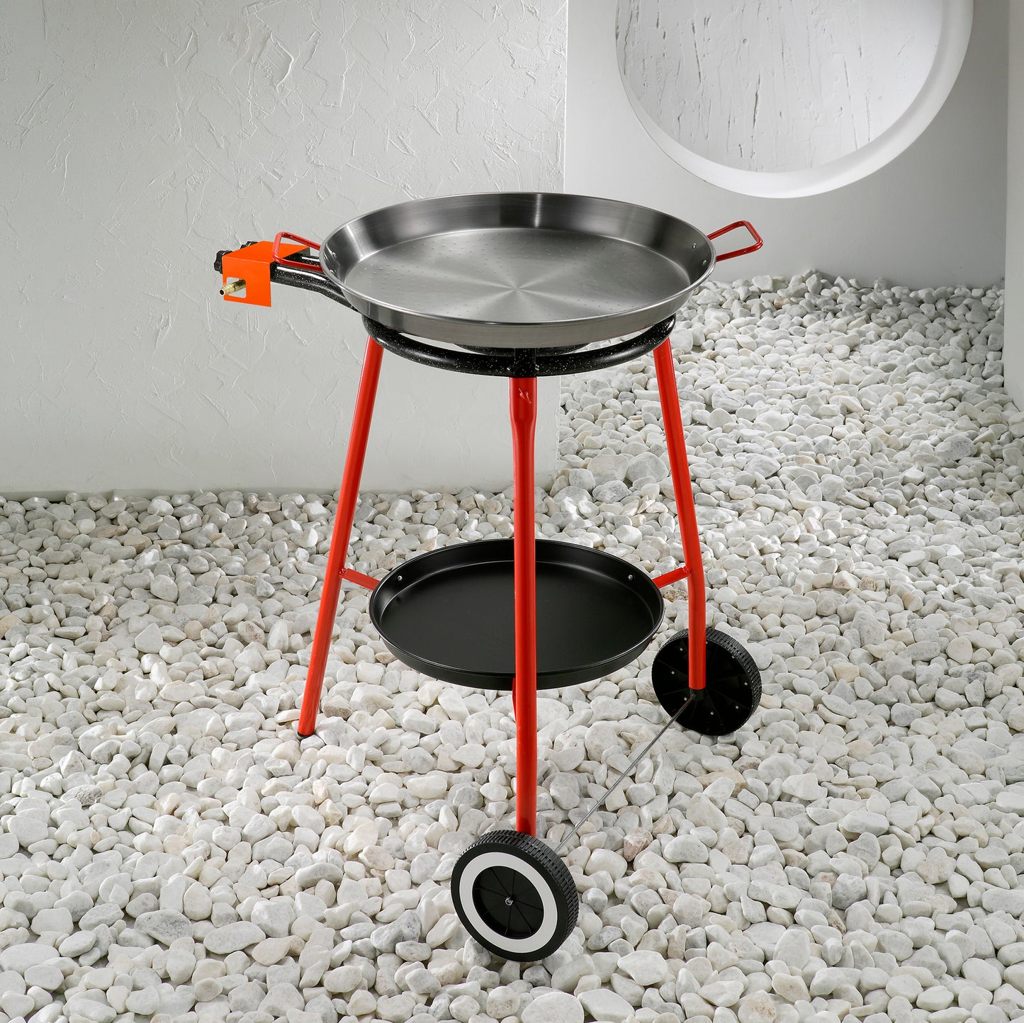 Stainless steel round grill with side handles, red frame, and bottom warming tray