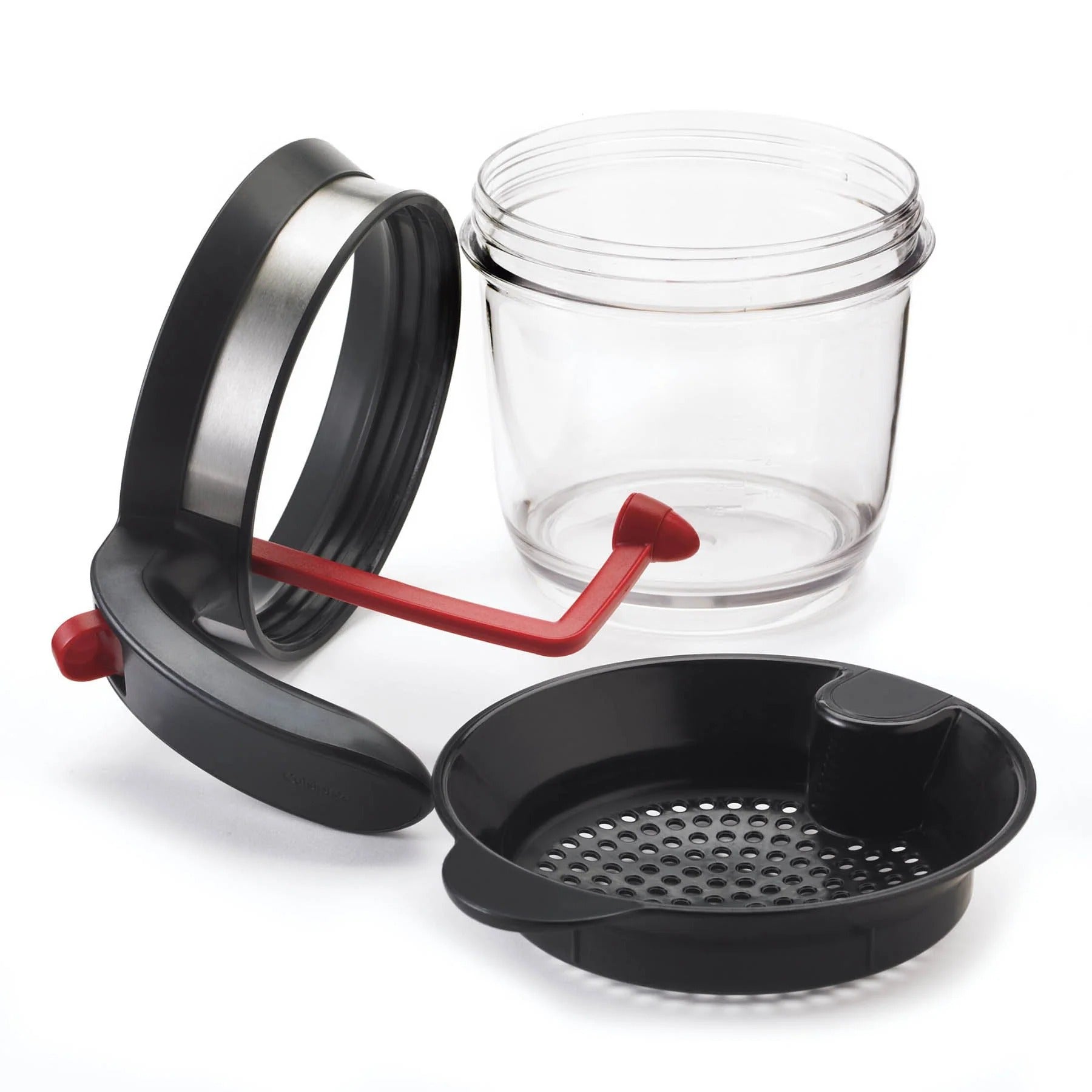 Fat separator set with clear jar, black strainer tray, and red draining lever handle