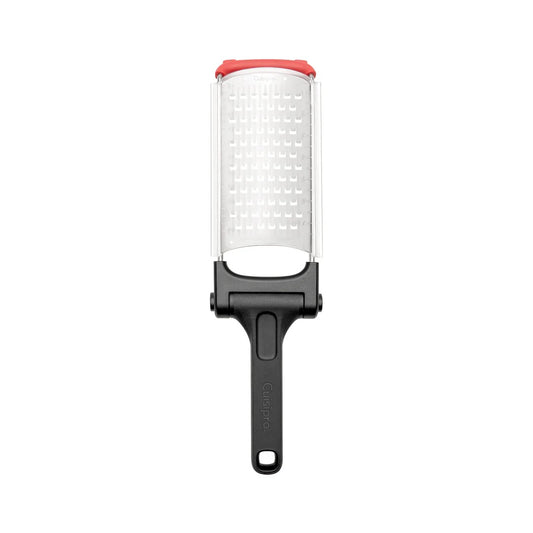 Folding grater with white grating drum, black folding handle, red safety cap