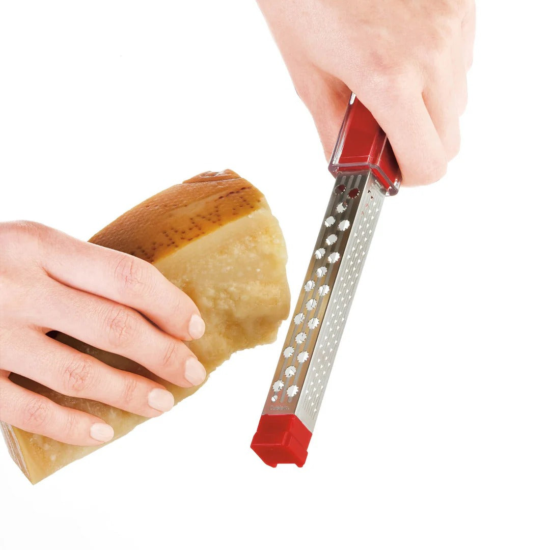 Pocket grater with red handle and stainless perforated grating face