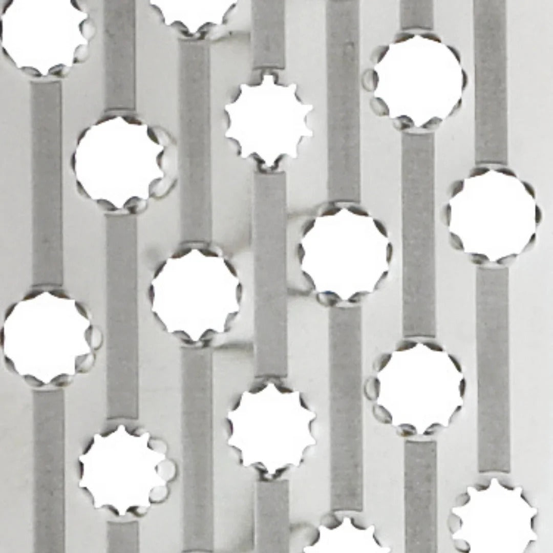 Stainless grating surface with circular cutouts for shredding