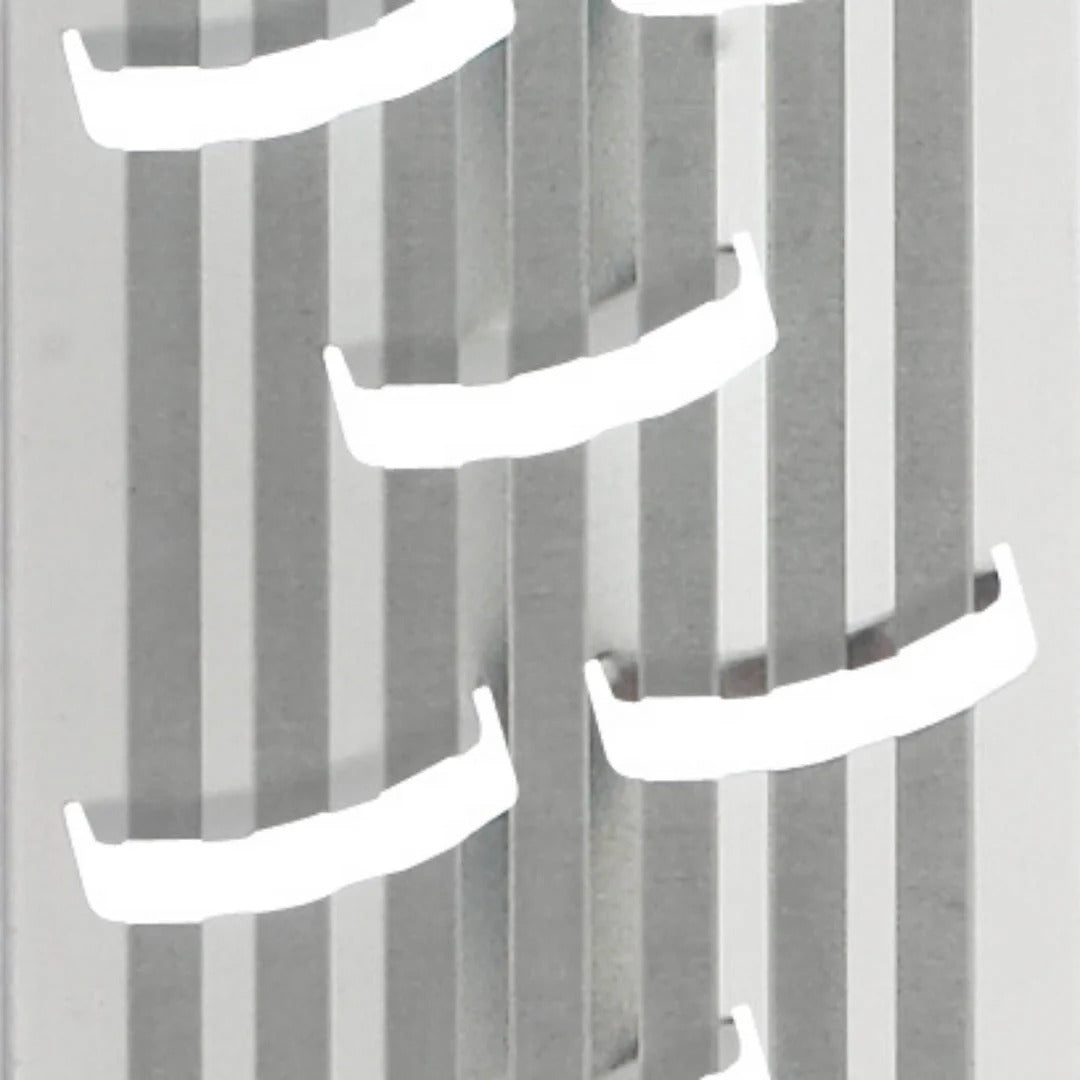 Close-up of box grater coarse grating slots on silver plate