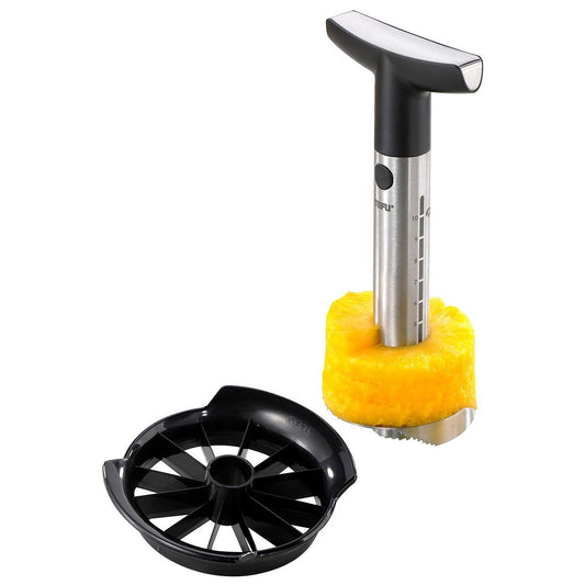 Pineapple slicer corer with serrated base and black cutting wheel on pineapple
