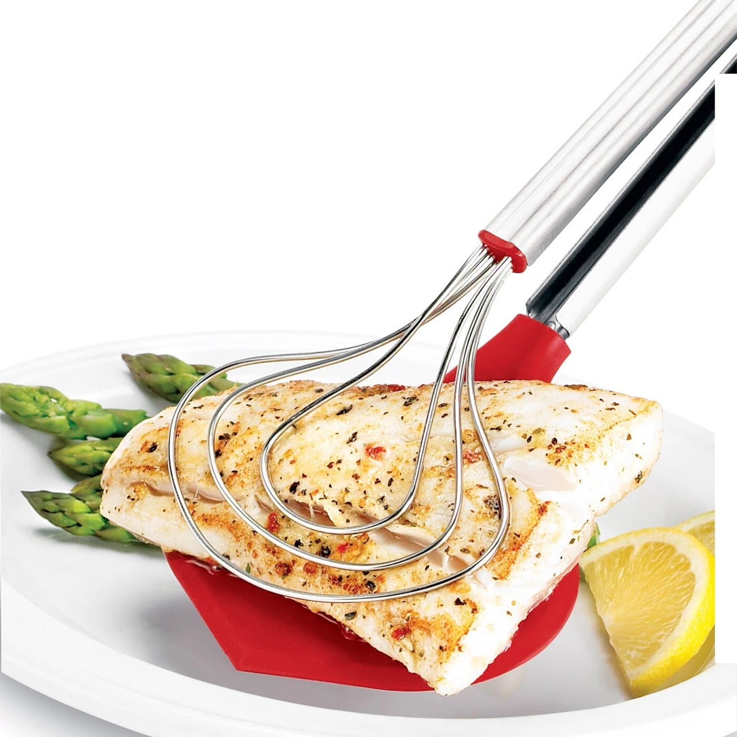 Red and stainless fish tongs on white plate holding grilled fish and lemon