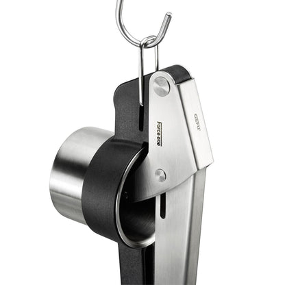 Potato press body with hanging loop, stainless metal housing, and black grip