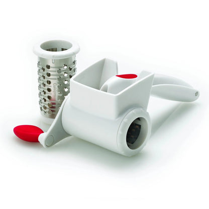 White rotary grater with red pads and cylindrical shredding drum