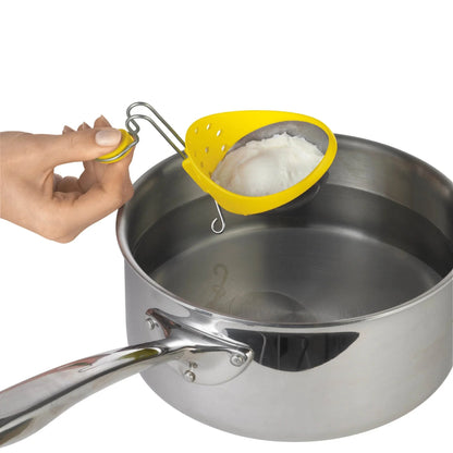 Egg poacher set: hand holds yellow cup over a stainless steel pan