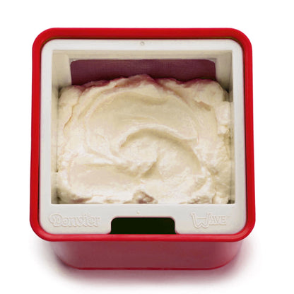 Red yogurt cheese maker base with pale curd filling and open top