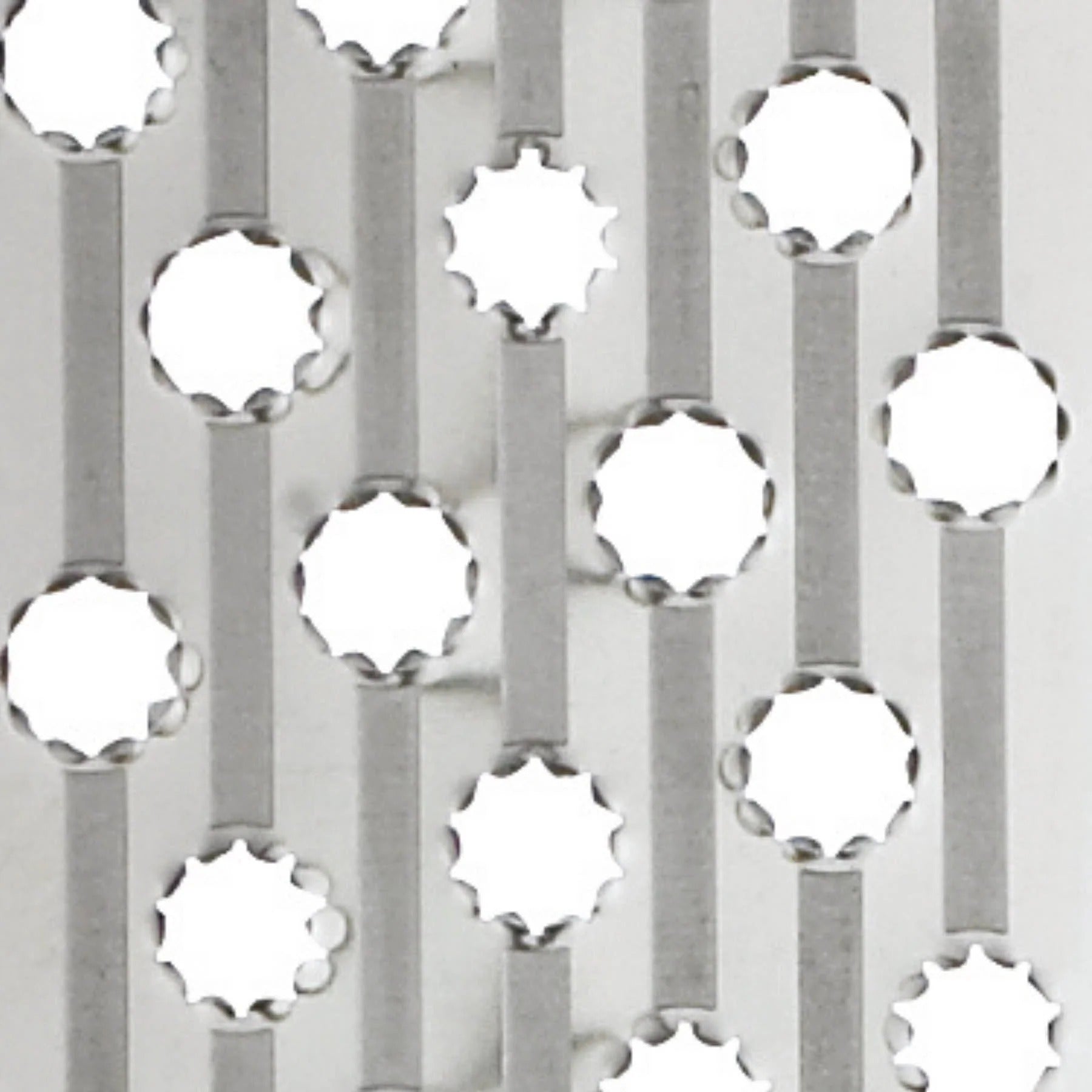 Rotary grater drum with circular metal grating holes