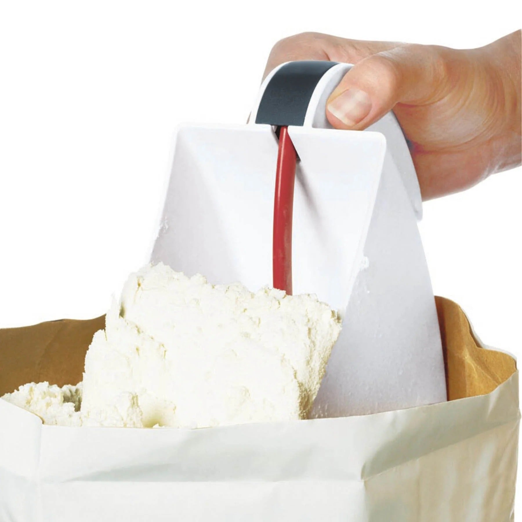 Flour sifter held above flour, red frame and white scoop