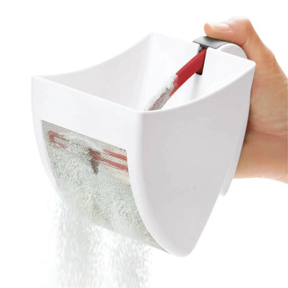 White sifter scoop with mesh filter and red handle, tilted