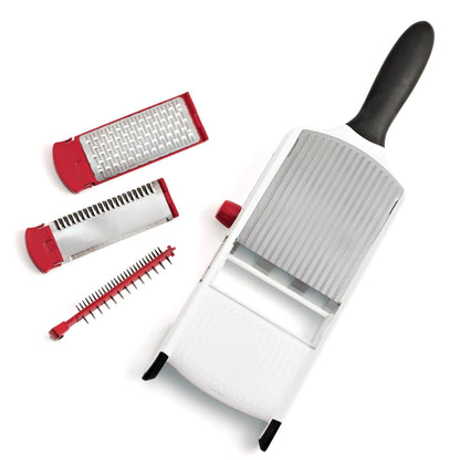Handheld mandoline slicer with black handle and white body, plus red blade inserts.